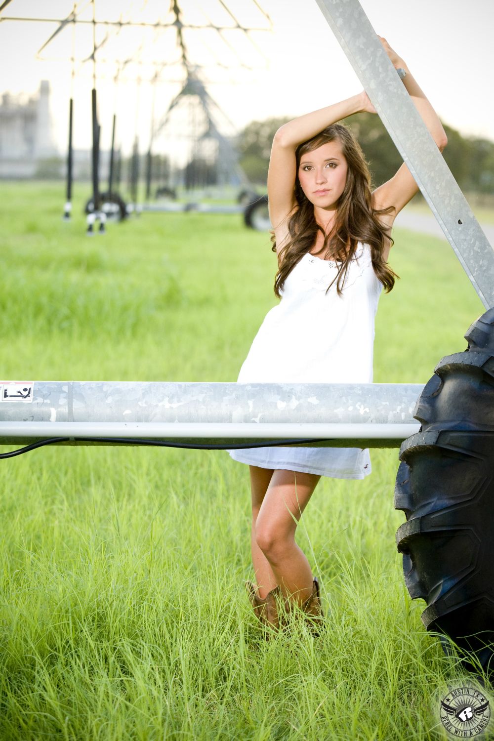 Rustic, country senior portrait photography of girl in white dress on farm in Central Texas.