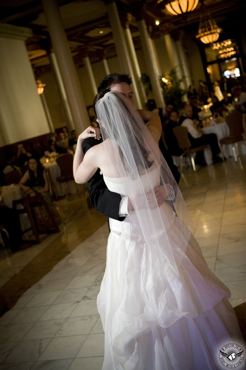 Picture of wedding couple's first dance at their wedding reception DJ Altared Weddings Austin wedding DJ at the Driskill Hotel Austin wedding venue in downtown Austin taken by Austin wedding photographer.