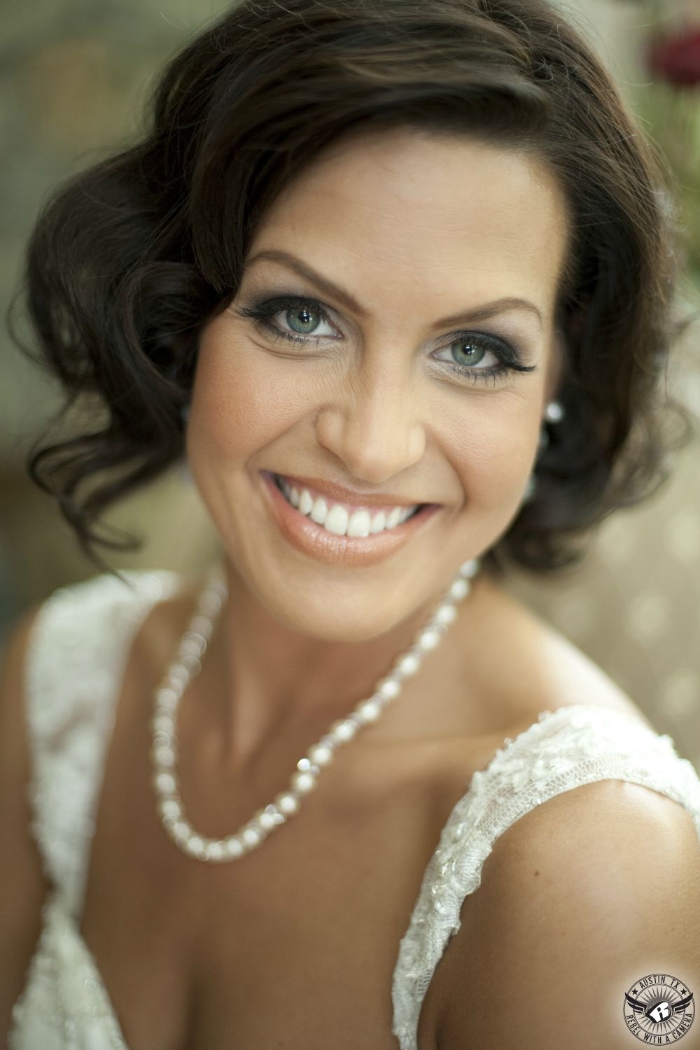 The gorgeous Lindsay Blackwell, owner of In Her Shoes Wedding Coordination Austin wedding planner, with makeup by Maris Malone Calderon at her own wedding in the bridal room at Nature's Point Austin wedding venue.