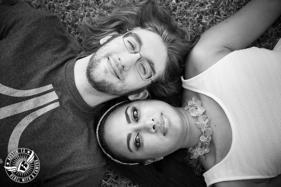 Fun Butler Park engagement session in Austin lying in the grass