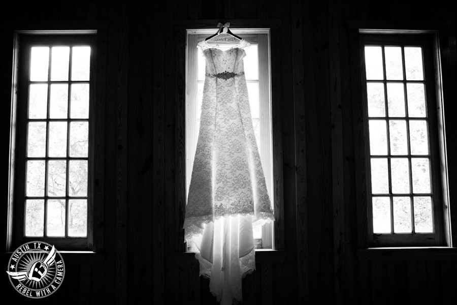 Sage Hall wedding photos at Texas Old Town wedding dress hanging in window