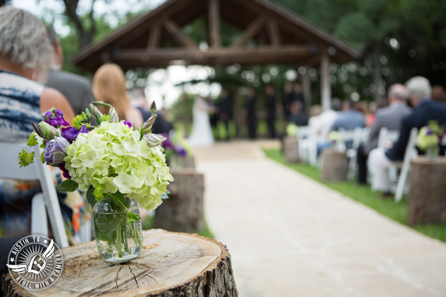 Sage Hall wedding photos at Texas Old Town green and purple floral aisle decor by STEMS Floral Design at wedding ceremony