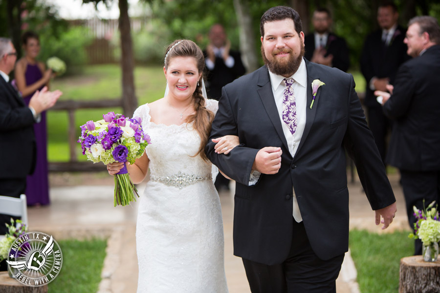 Sage Hall wedding photos at Texas Old Town happy bride and groom walk down the aisle during the wedding ceremony