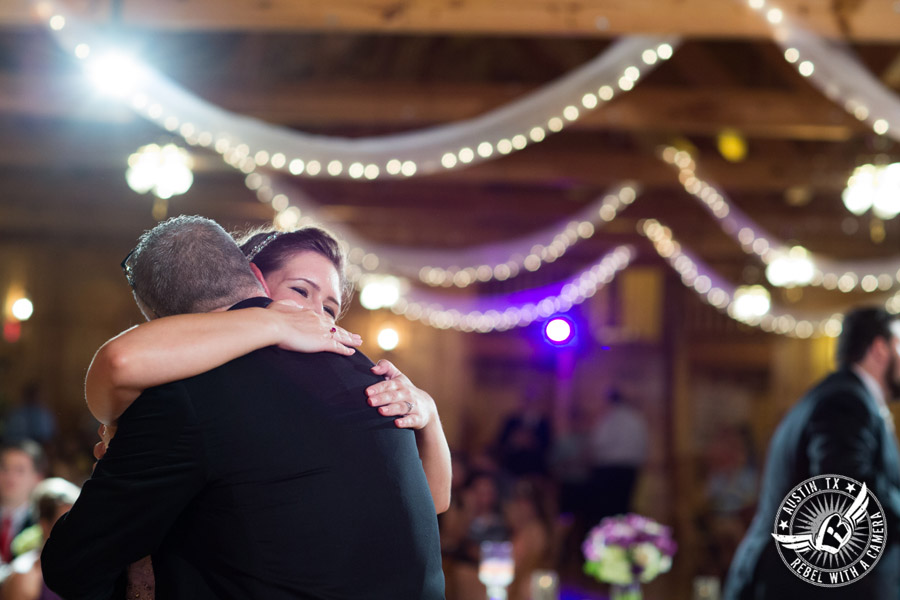 Sage Hall wedding photos at Texas Old Town bride hugs father during father/daughter dance at wedding reception