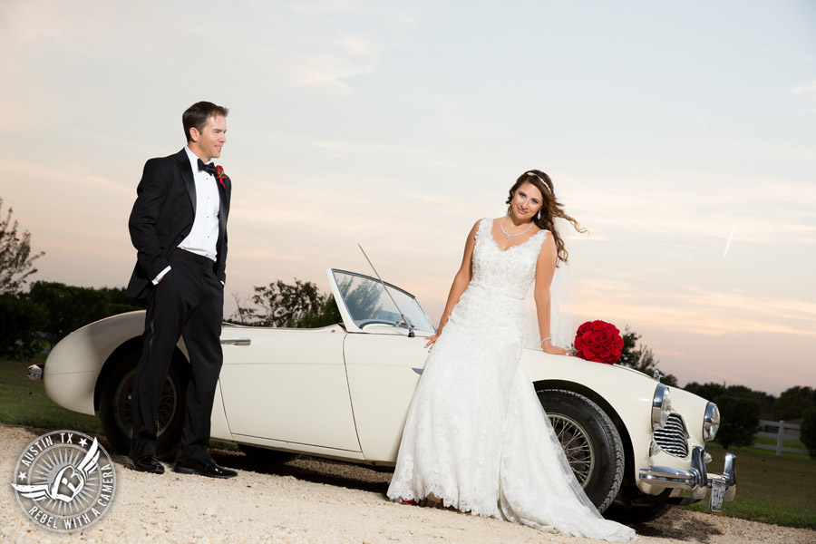 Taylor Mansion wedding photo of bride and groom with white convertible