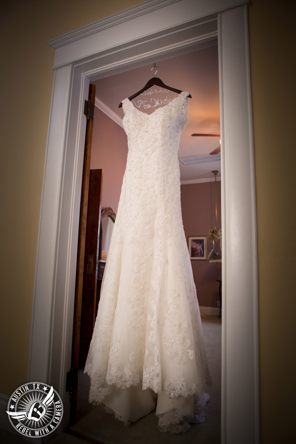 Taylor Mansion wedding photo of wedding dress hanging in bride's room