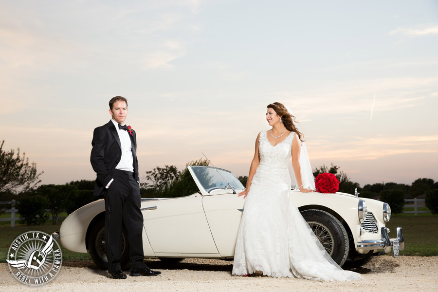 Taylor Mansion wedding photo of bride and groom with white convertible