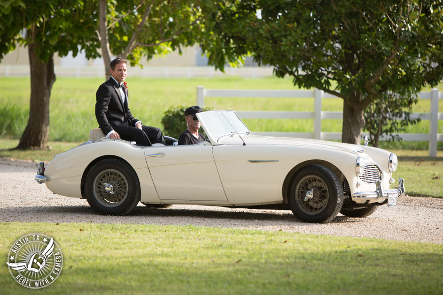 Taylor Mansion wedding photo groom rides white convertible to the wedding ceremony