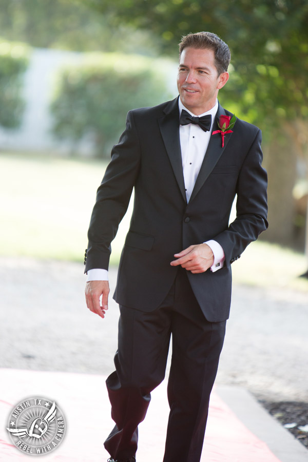 Taylor Mansion wedding photo groom walks down the aisle at wedding ceremony