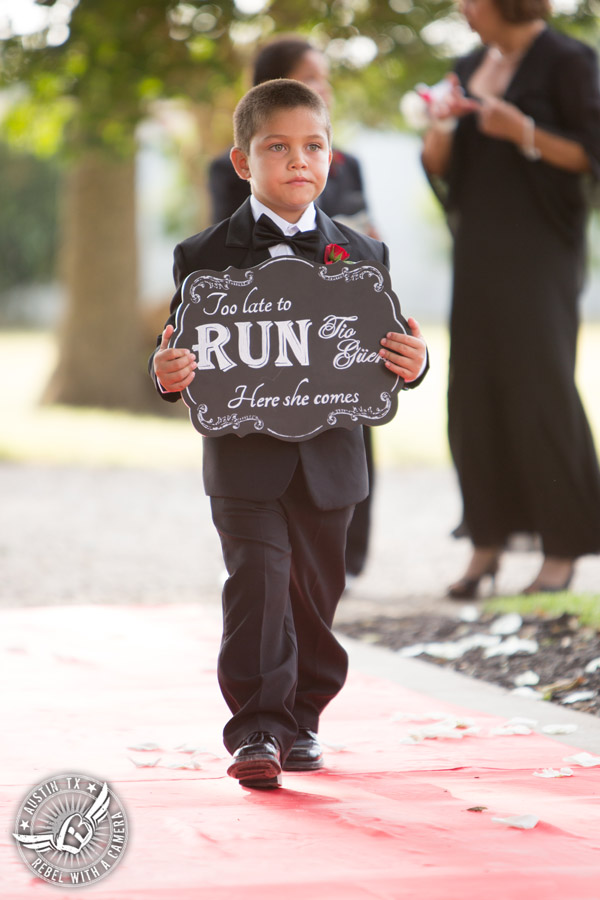 Taylor Mansion wedding photo ring bearer walks down the aisle at wedding ceremony