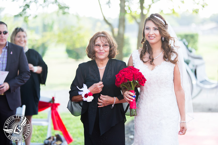 Taylor Mansion wedding photo bride walks down the aisle with mother at wedding ceremony