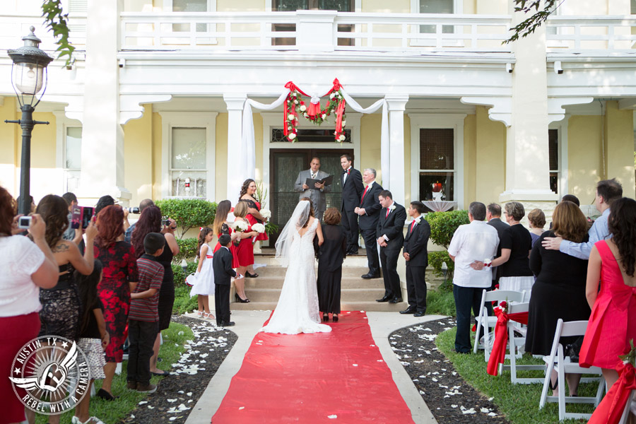 Taylor Mansion wedding photo bride walks down the aisle with mother at wedding ceremony