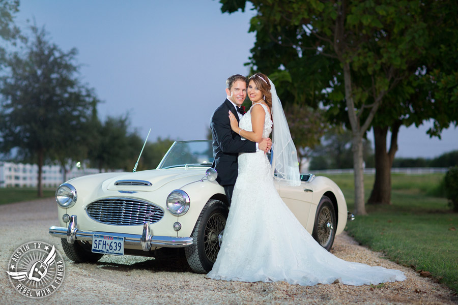Taylor Mansion wedding photo of bride and groom with white convertible