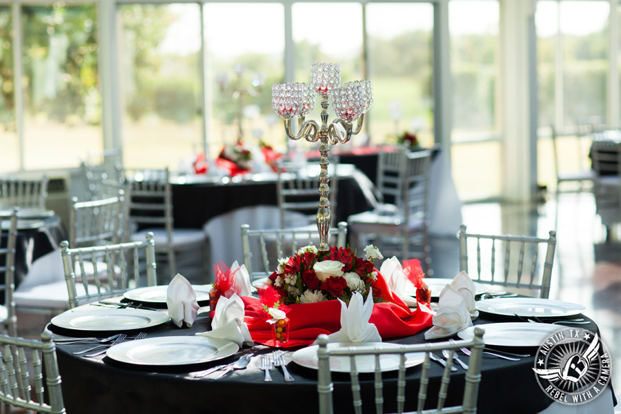 Taylor Mansion wedding photo of candelabra centerpiece on table with silver chiavari chairs in Crystal Ballroom