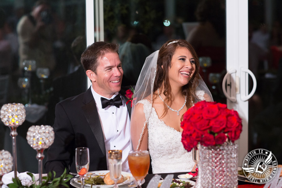 Taylor Mansion wedding photo bride and groom laugh during toasts in Crystal Ballroom