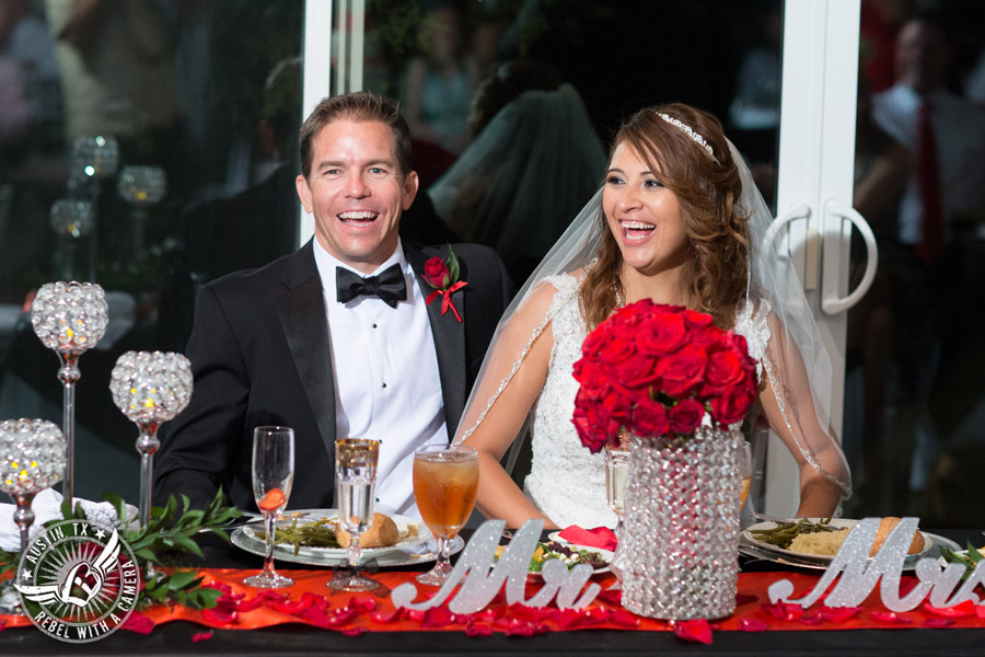 Taylor Mansion wedding photo bride and groom laugh during toasts in Crystal Ballroom