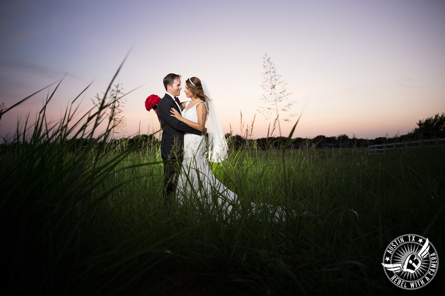 Taylor Mansion wedding photo of bride and groom in field at sunset