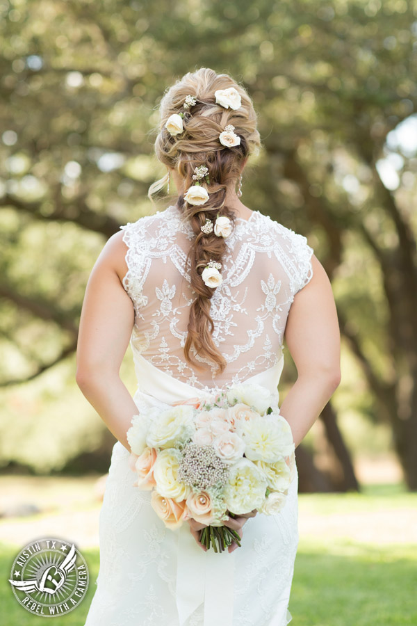 Gabriel Springs bridal portrait in Georgetown, Texas, with hair and makeup by Kiss by Katie and bouquet by Sixpence Floral Design at the Springs Events