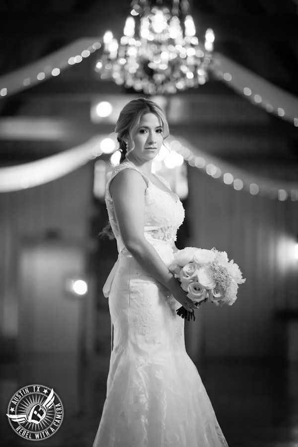 Gabriel Springs bridal portrait in Georgetown, Texas, with hair and makeup by Kiss by Katie and bouquet by Sixpence Floral Design at the Springs Events