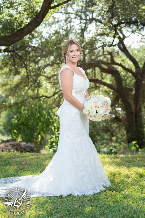 Gabriel Springs bridal portrait in Georgetown, Texas, with hair and makeup by Kiss by Katie and bouquet by Sixpence Floral Design at the Springs Events