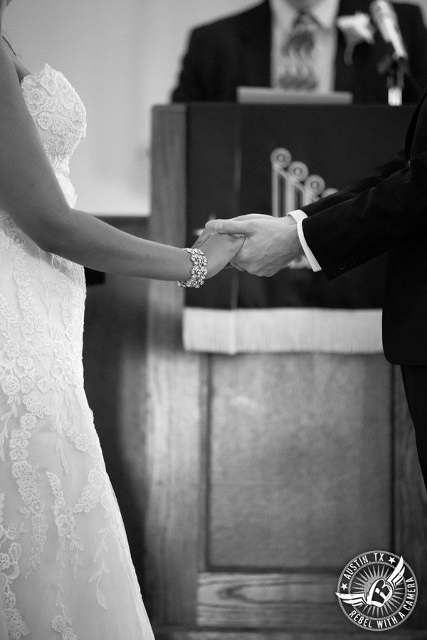 Austin wedding photographer at Hyde Park Presbyterian - bride and groom hold hands at wedding ceremony