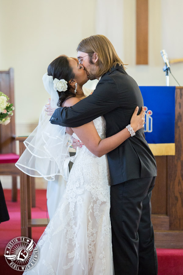 Austin wedding photographer at Hyde Park Presbyterian - bride and groom kiss at wedding ceremony