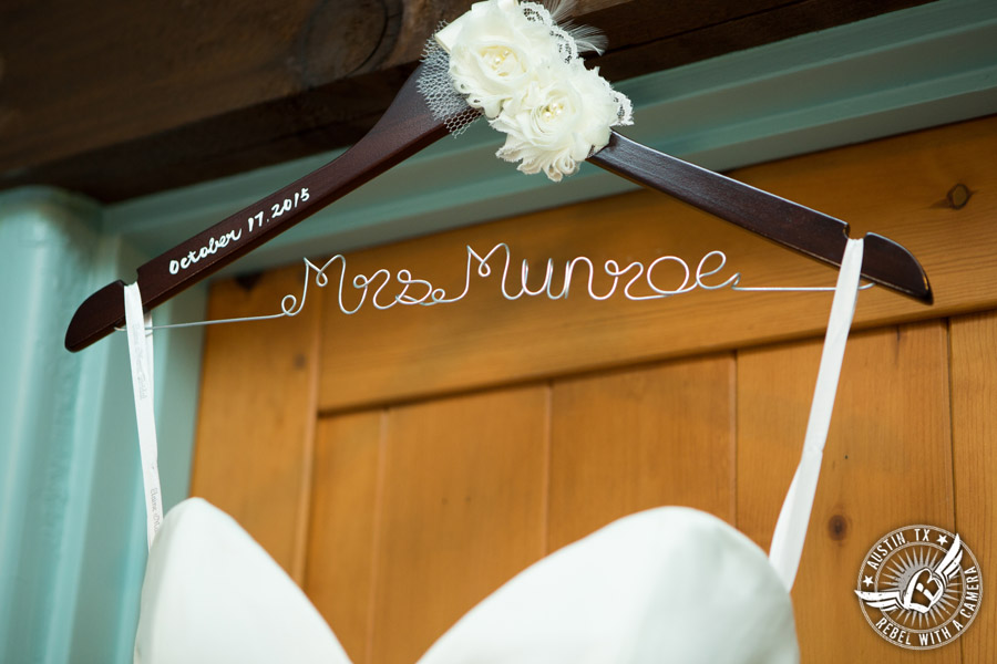 Hamilton Twelve wedding photos - wedding dress hanging in bride's room on custom made Mrs. hanger