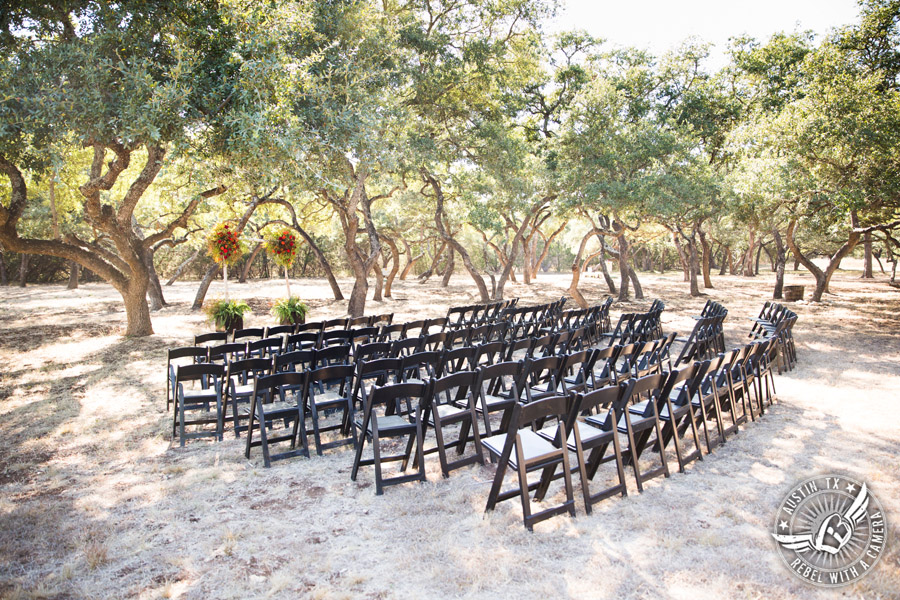 Hamilton Twelve wedding photos - ceremony site dark wood chairS and arbor by the Flower Girl