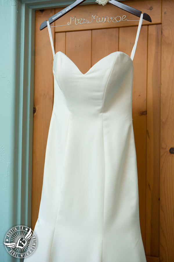 Hamilton Twelve wedding photos - wedding dress hanging in bride's room on custom made Mrs. hanger