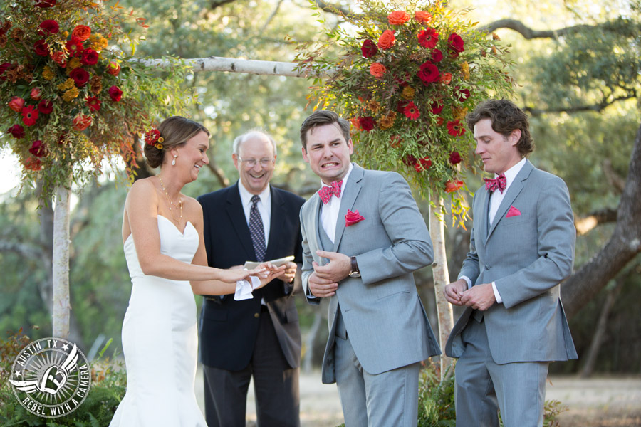 Hamilton Twelve wedding photos - groom and bride laugh during ring exchange