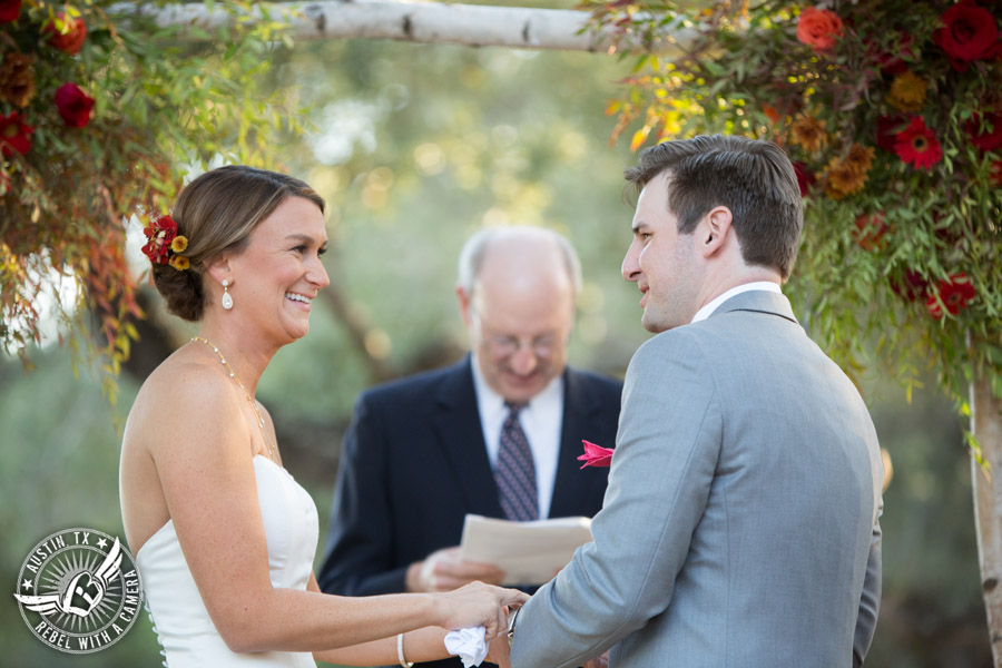 Hamilton Twelve wedding photos - groom and bride laugh during wedding ceremony