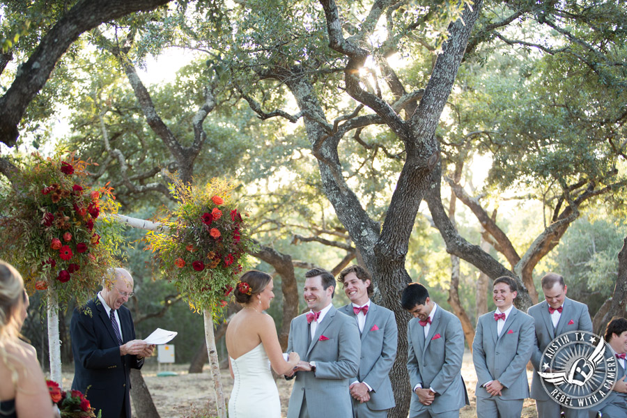 Hamilton Twelve wedding photos - groom and bride laugh during wedding ceremony