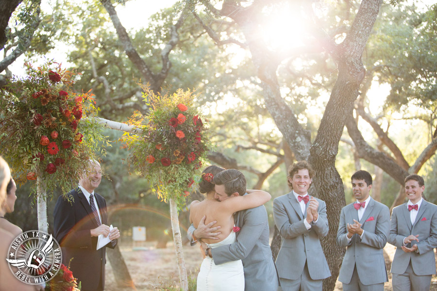 Hamilton Twelve wedding photos - groom and bride embrace at end of wedding ceremony