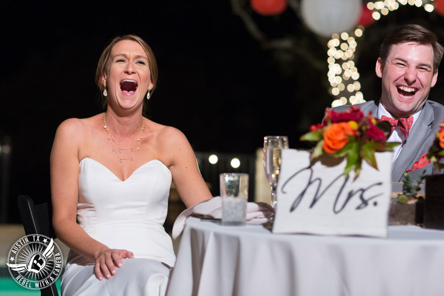 Hamilton Twelve wedding photos - bride and groom laugh during toasts at wedding reception