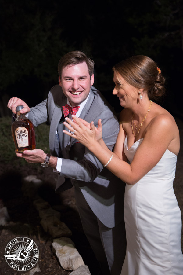 Hamilton Twelve wedding photos - groom digs up buried bottle of bourbon