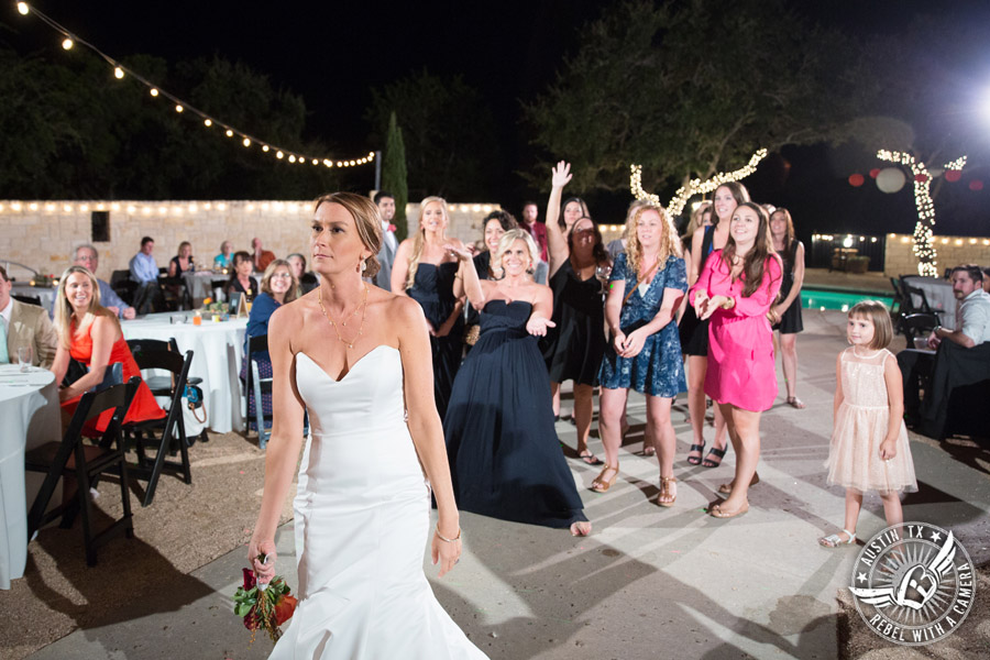Hamilton Twelve wedding photos - bride throws bouquet during wedding reception