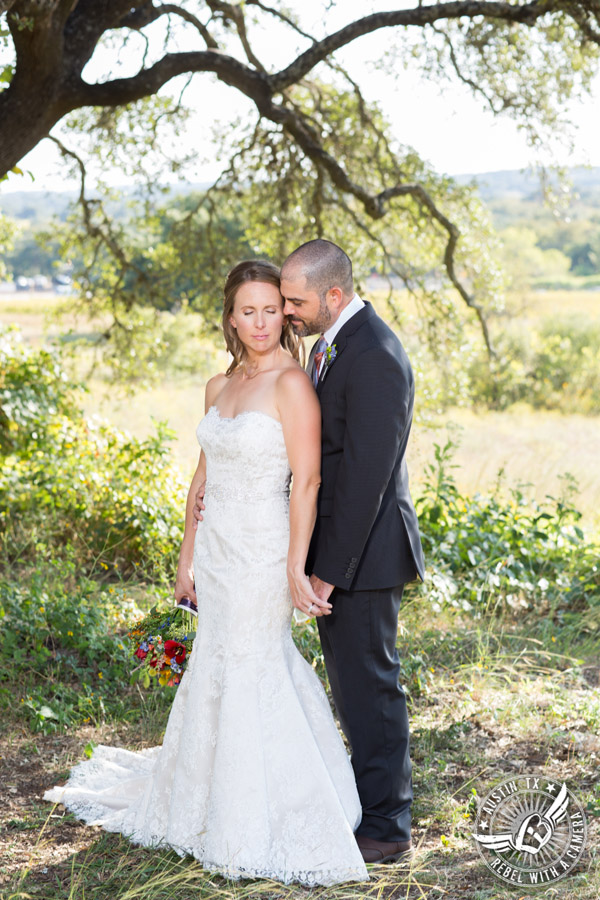 Wedding pictures at Thurman's Mansion at the Salt Lick - bride and groom under the oak trees