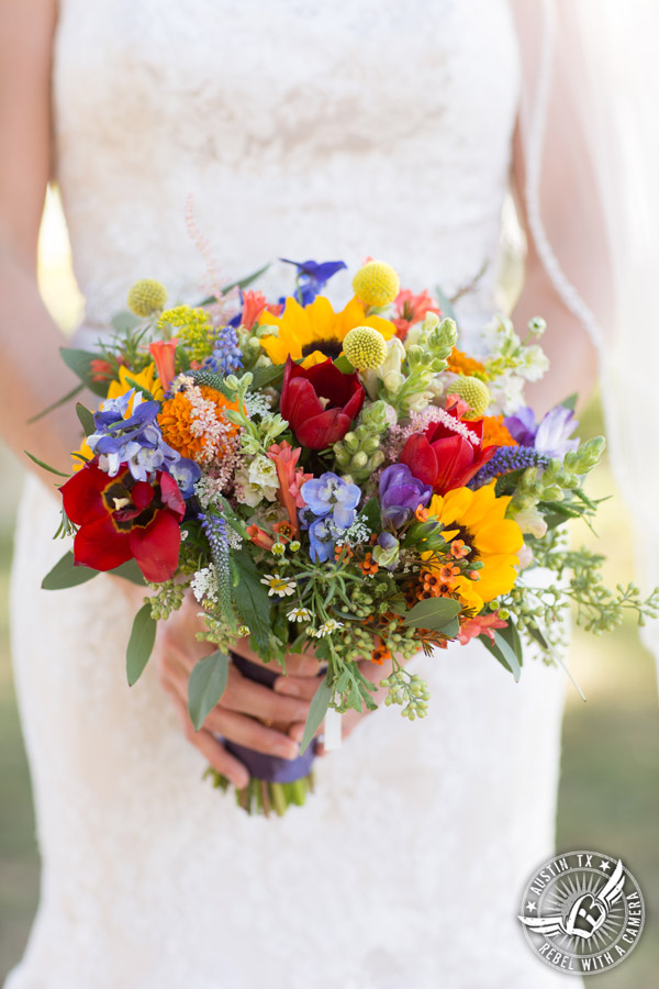 Wedding pictures at Thurman's Mansion at the Salt Lick - colorful wildflower bridal bouquet by Verbena Floral Design