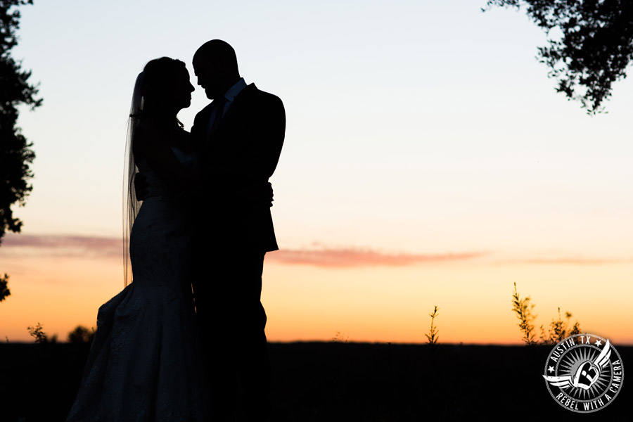 Wedding pictures at Thurman's Mansion at the Salt Lick - silhouette of bride and groom with the sunset