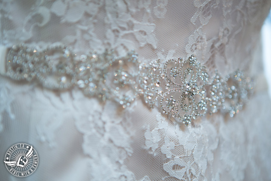 Wedding pictures at Thurman's Mansion at the Salt Lick - rhinestone detail on lace bridal gown