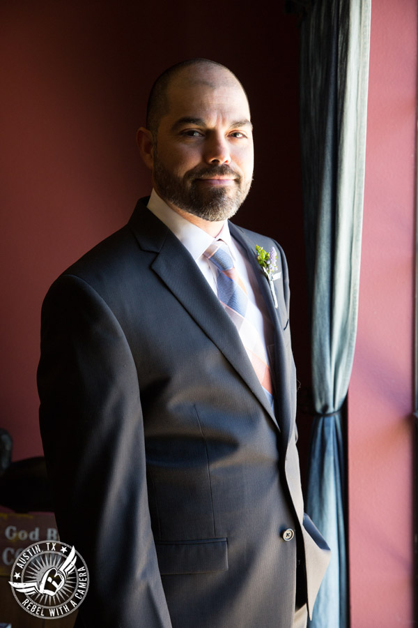 Wedding pictures at Thurman's Mansion at the Salt Lick - portrait of groom in window light in the groom's room