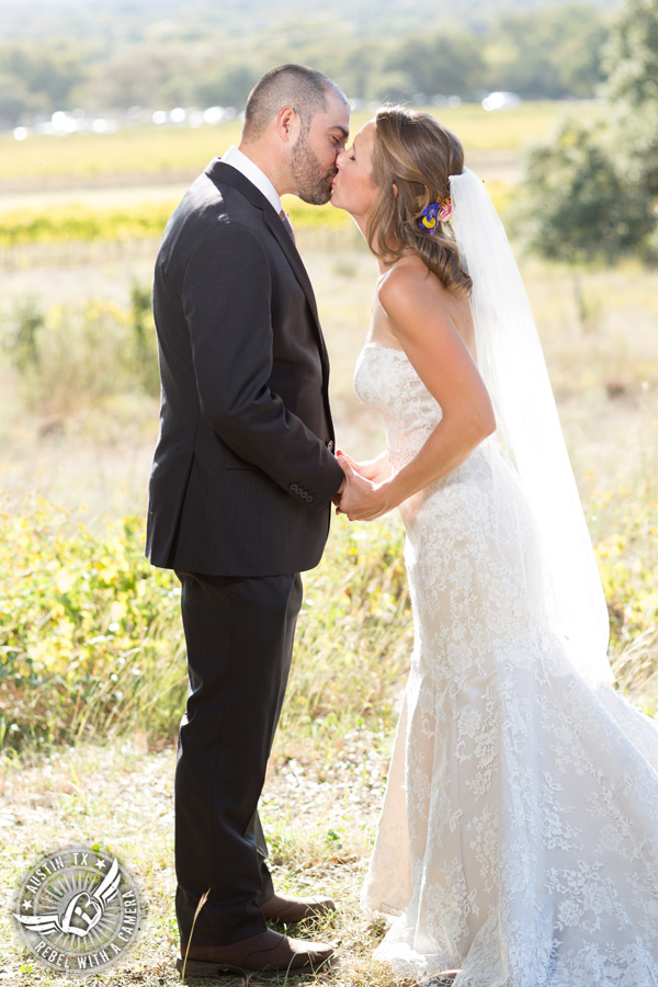 Wedding pictures at Thurman's Mansion at the Salt Lick - bride and groom kiss