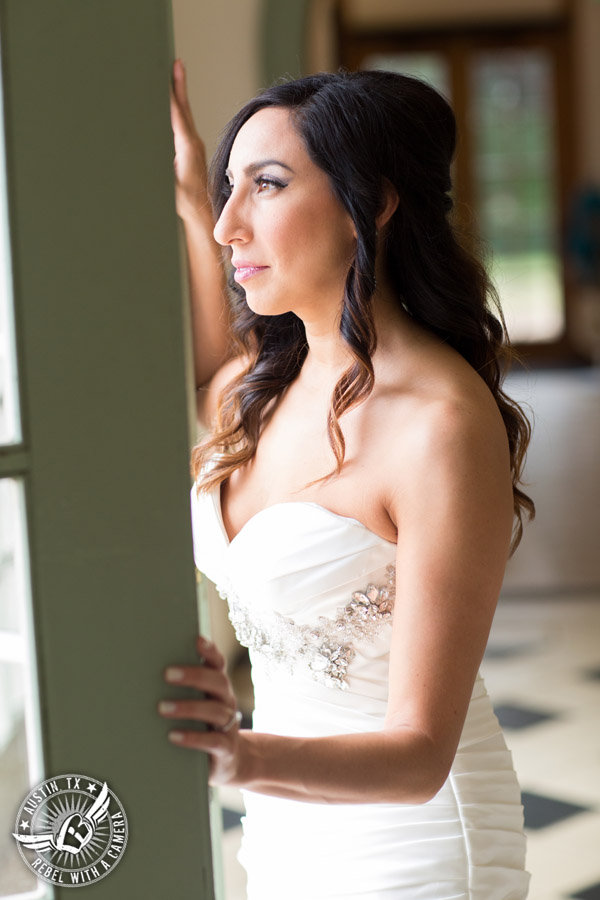 Dramatic bridal portraits at Laguna Gloria the Contemporary Austin with bridal hair styling by Sirens Salon.