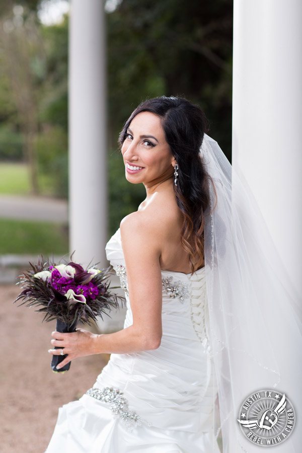 Dramatic bridal portraits at Laguna Gloria the Contemporary Austin with purple calla lily bouquet by Statue of Design.