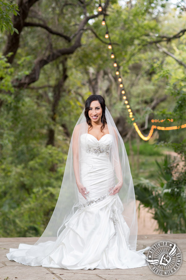 Dramatic bridal portraits at Laguna Gloria the Contemporary Austin with bridal hair styling by Sirens Salon.