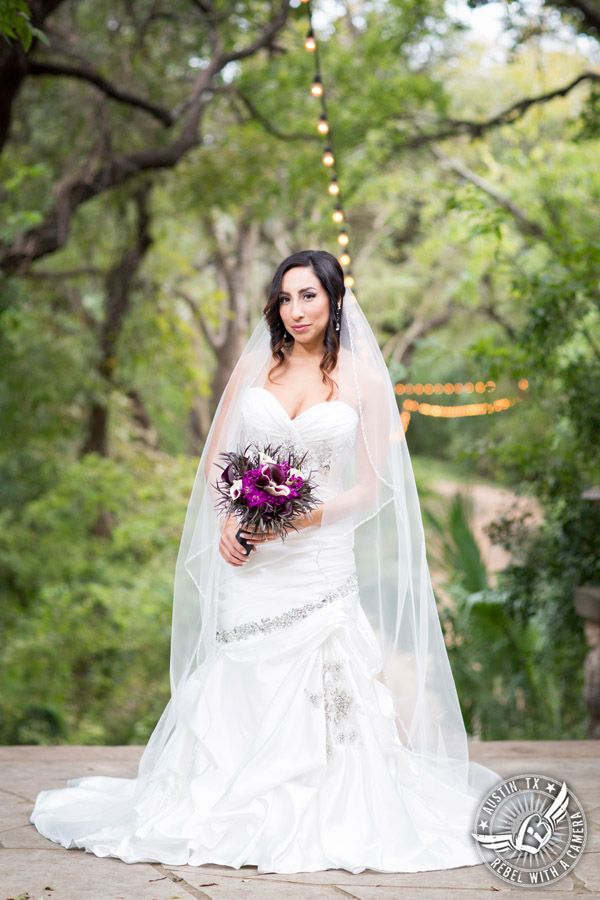 Dramatic bridal portraits at Laguna Gloria the Contemporary Austin with purple calla lily bouquet by Statue of Design.