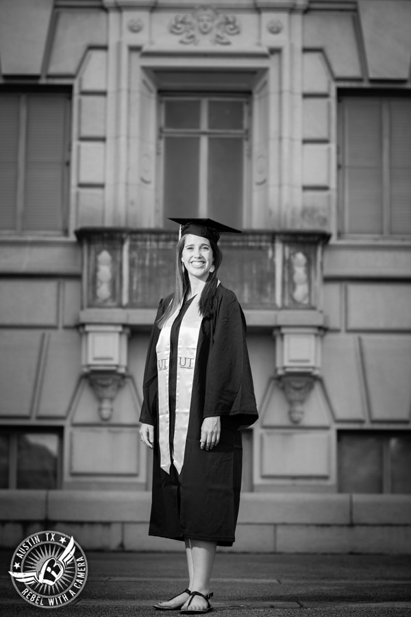 Longhorn graduation pictures on the UT Austin campus - graduate in cap and gown