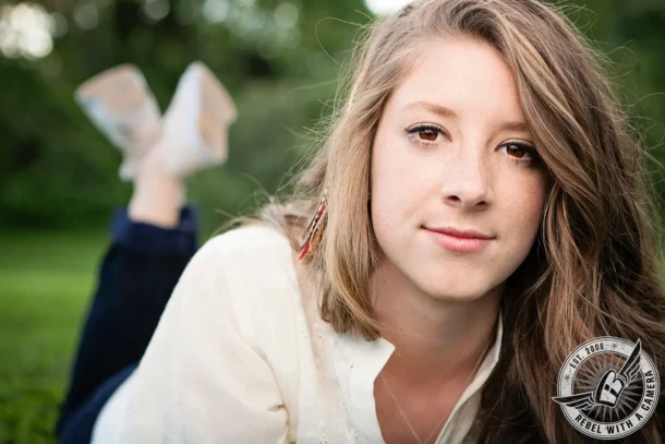 close-up young woman in a white blouse outdoors in Austin, TX.