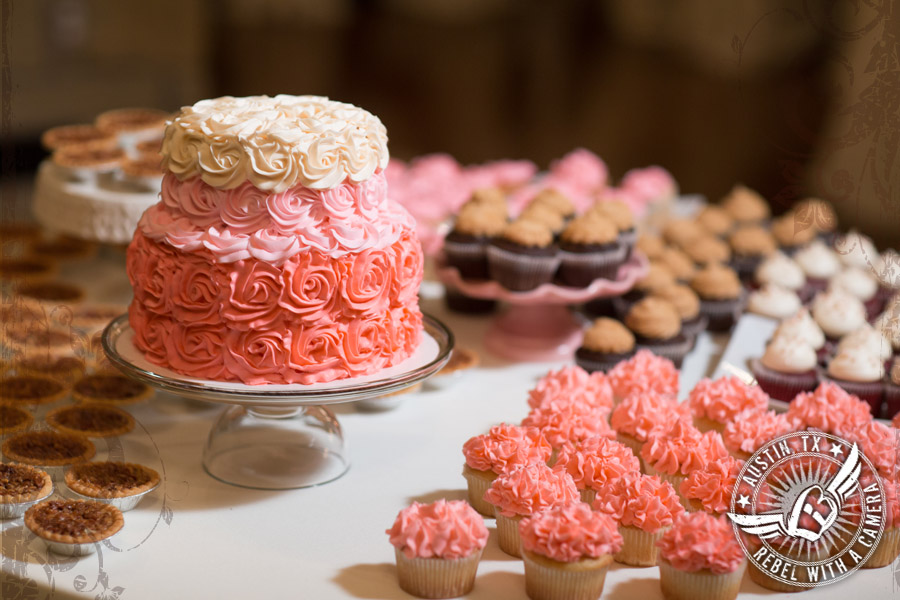 wedding cake and cupcakes in shades of pink ombre