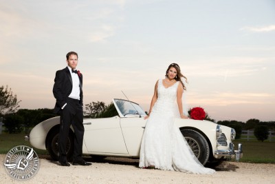 Taylor Mansion wedding photo of bride and groom with white convertible